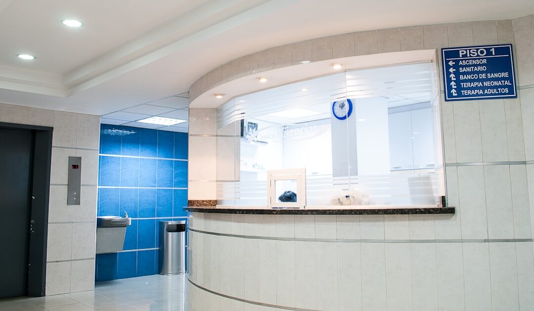 A clinic reception area with wayfinding signage