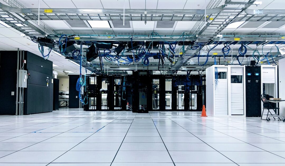 Rows of server cabinets under overhead cable trays